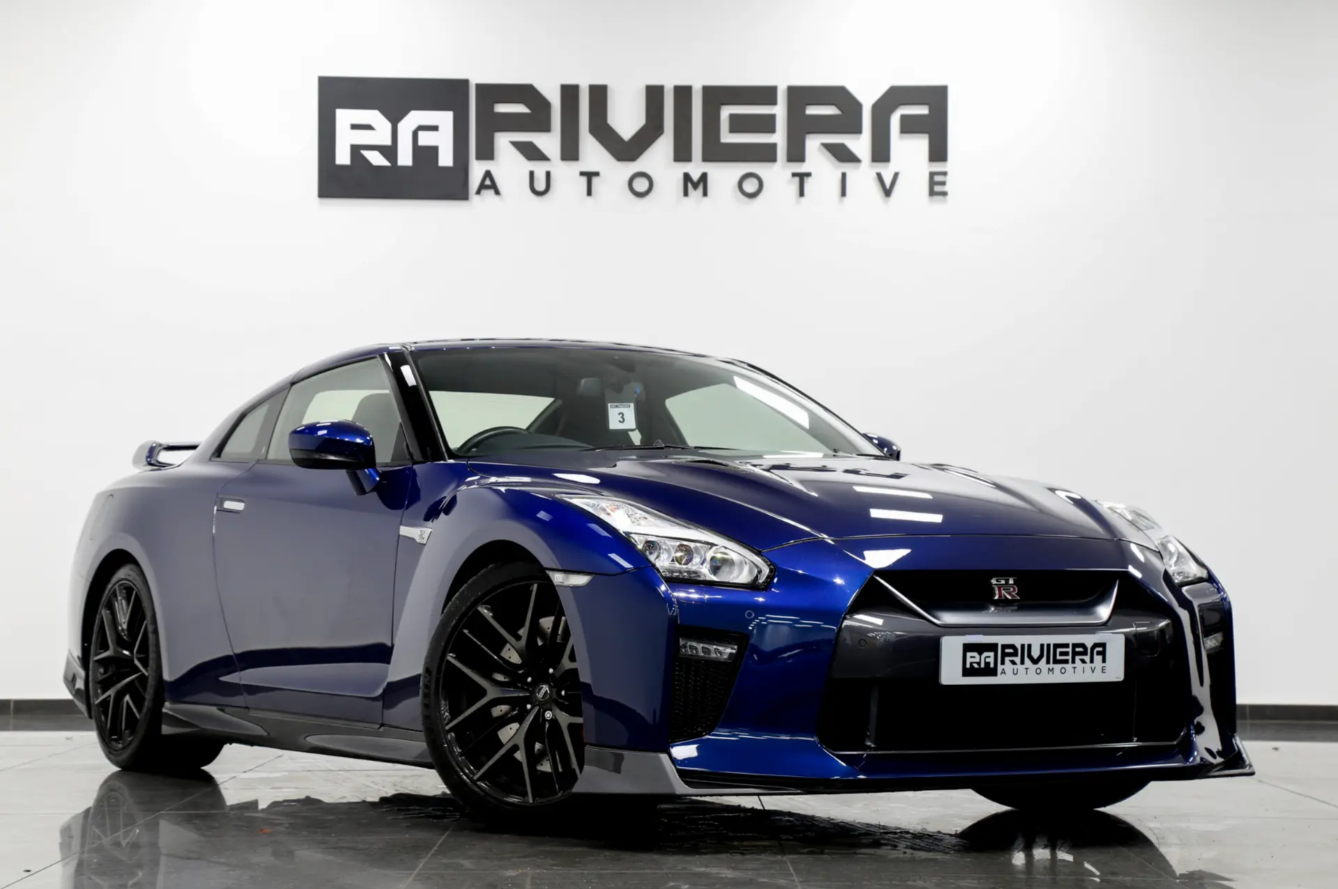 Blue Nissan GT-R in the Riviera Automotive showroom